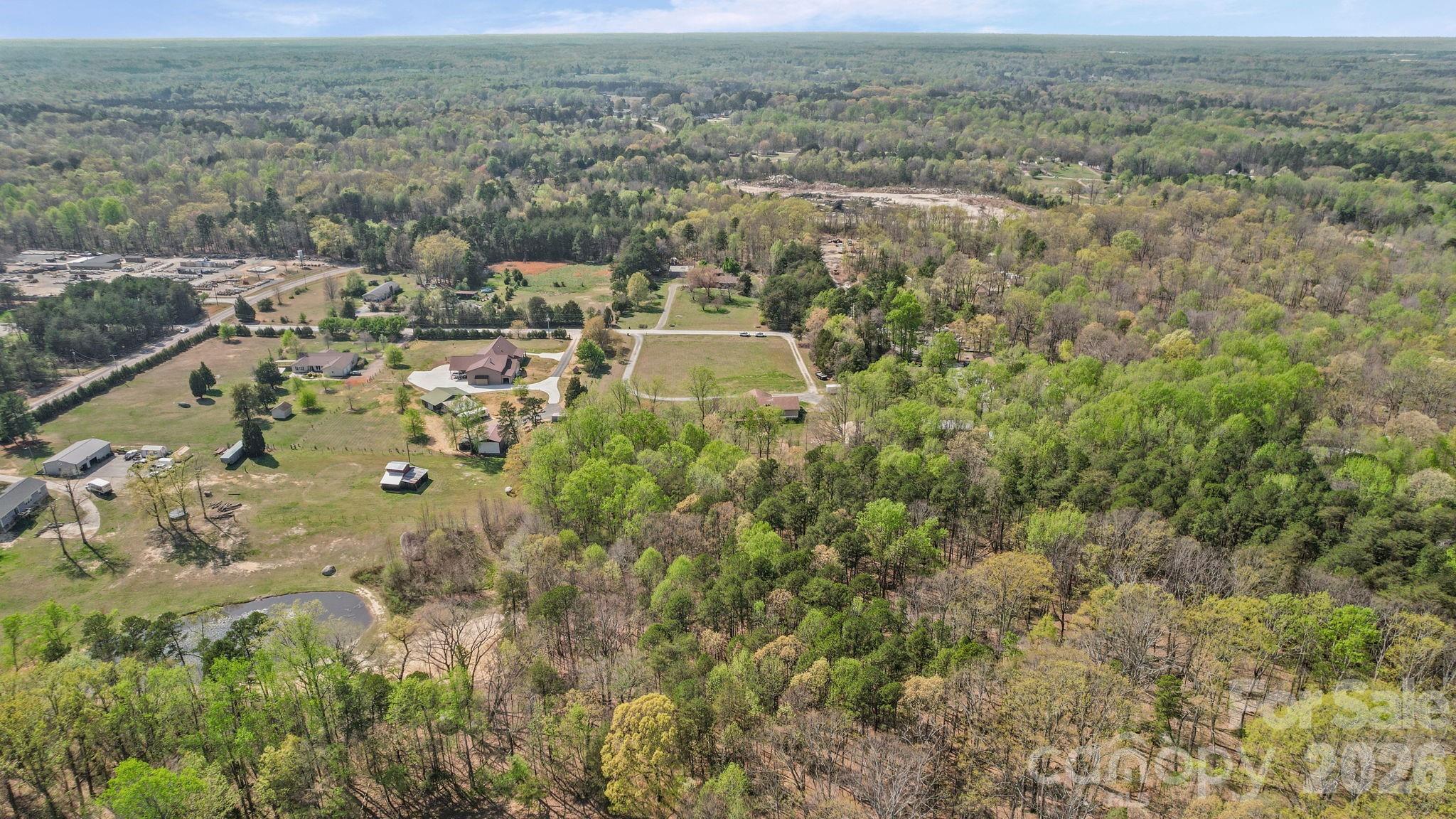 235 Spring Estates Circle Salisbury, NC 28146 - Photo 11 of 47 an aerial view of residential house with space and mountain view
