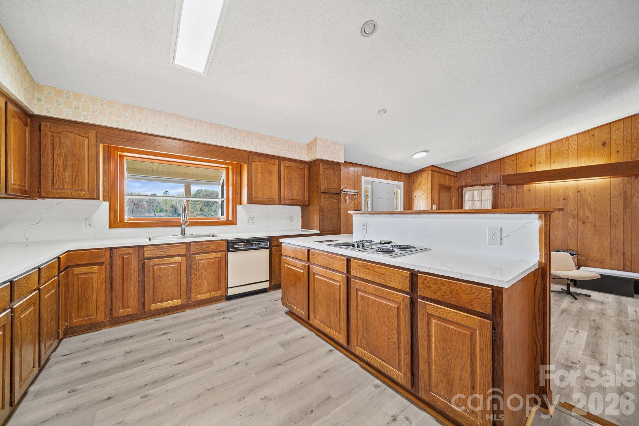 235 Spring Estates Circle Salisbury, NC 28146 - Photo 13 of 47 a kitchen with a stove top oven sink and cabinets