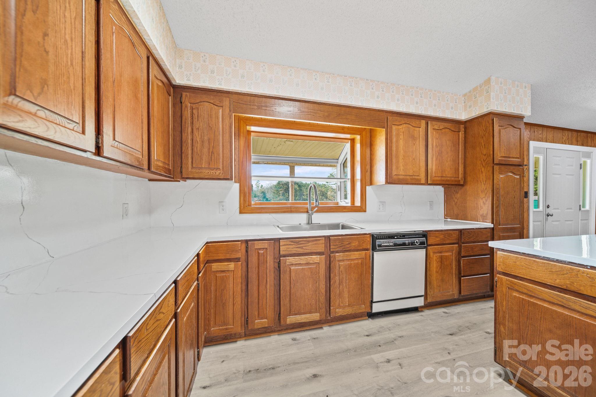235 Spring Estates Circle Salisbury, NC 28146 - Photo 15 of 47 a kitchen with stainless steel appliances granite countertop a sink and cabinets