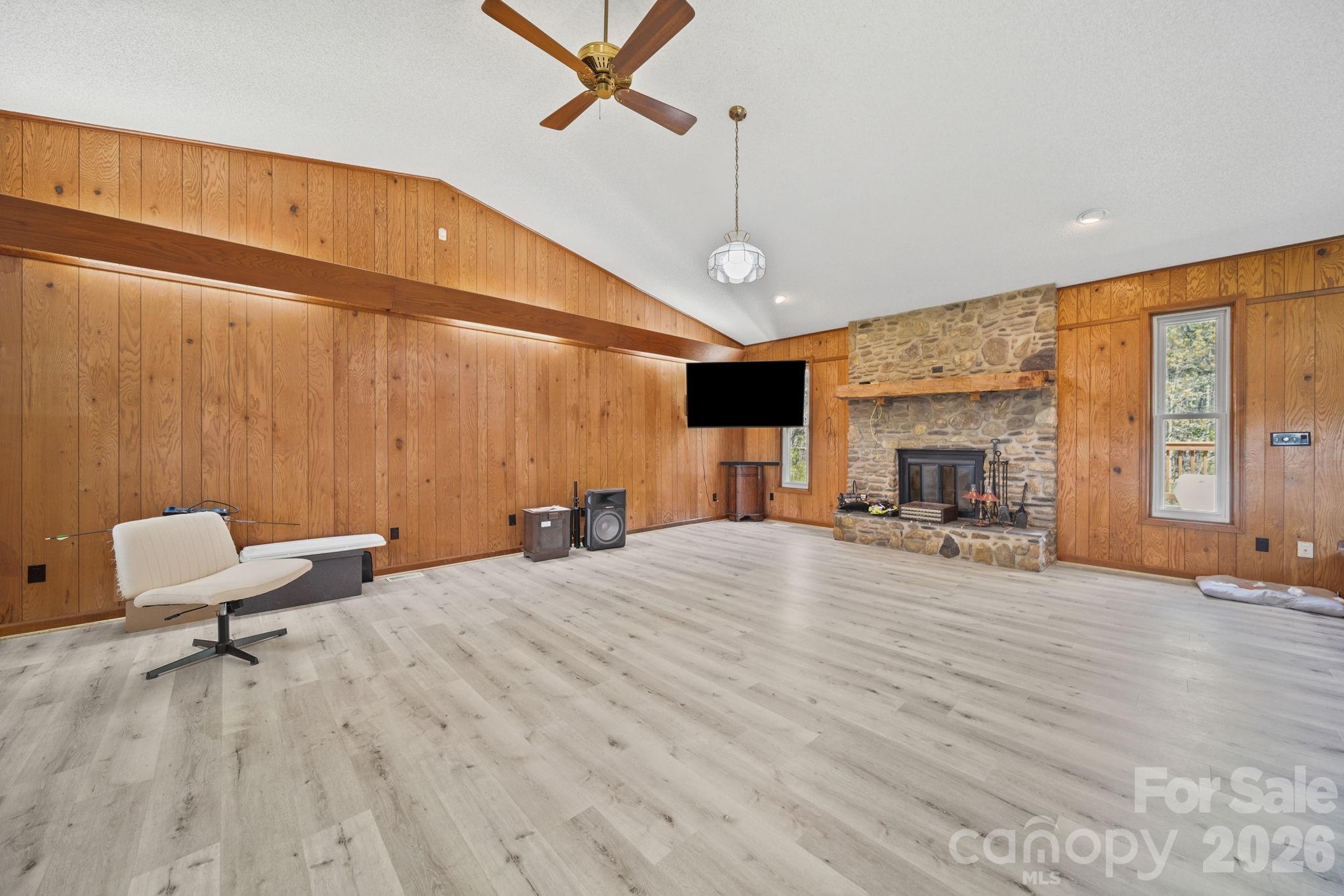 235 Spring Estates Circle Salisbury, NC 28146 - Photo 17 of 47 a spacious bedroom with a bed a table and wooden floor