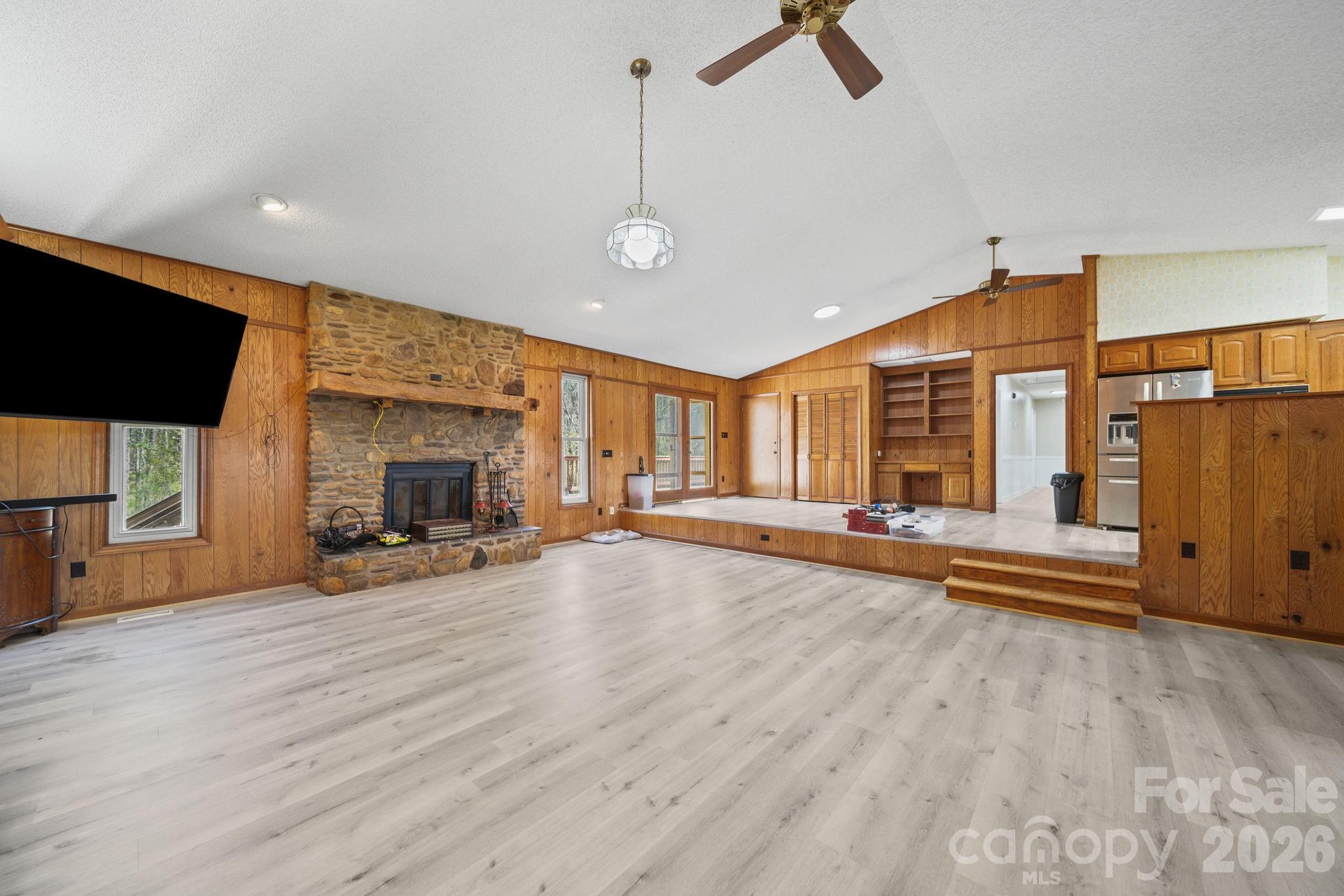 235 Spring Estates Circle Salisbury, NC 28146 - Photo 18 of 47 a view of a livingroom with hardwood floor and a ceiling fan