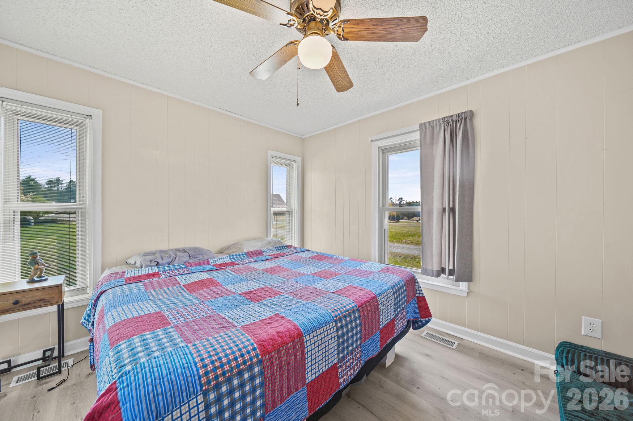 235 Spring Estates Circle Salisbury, NC 28146 - Photo 28 of 47 a bedroom with a bed and a chandelier