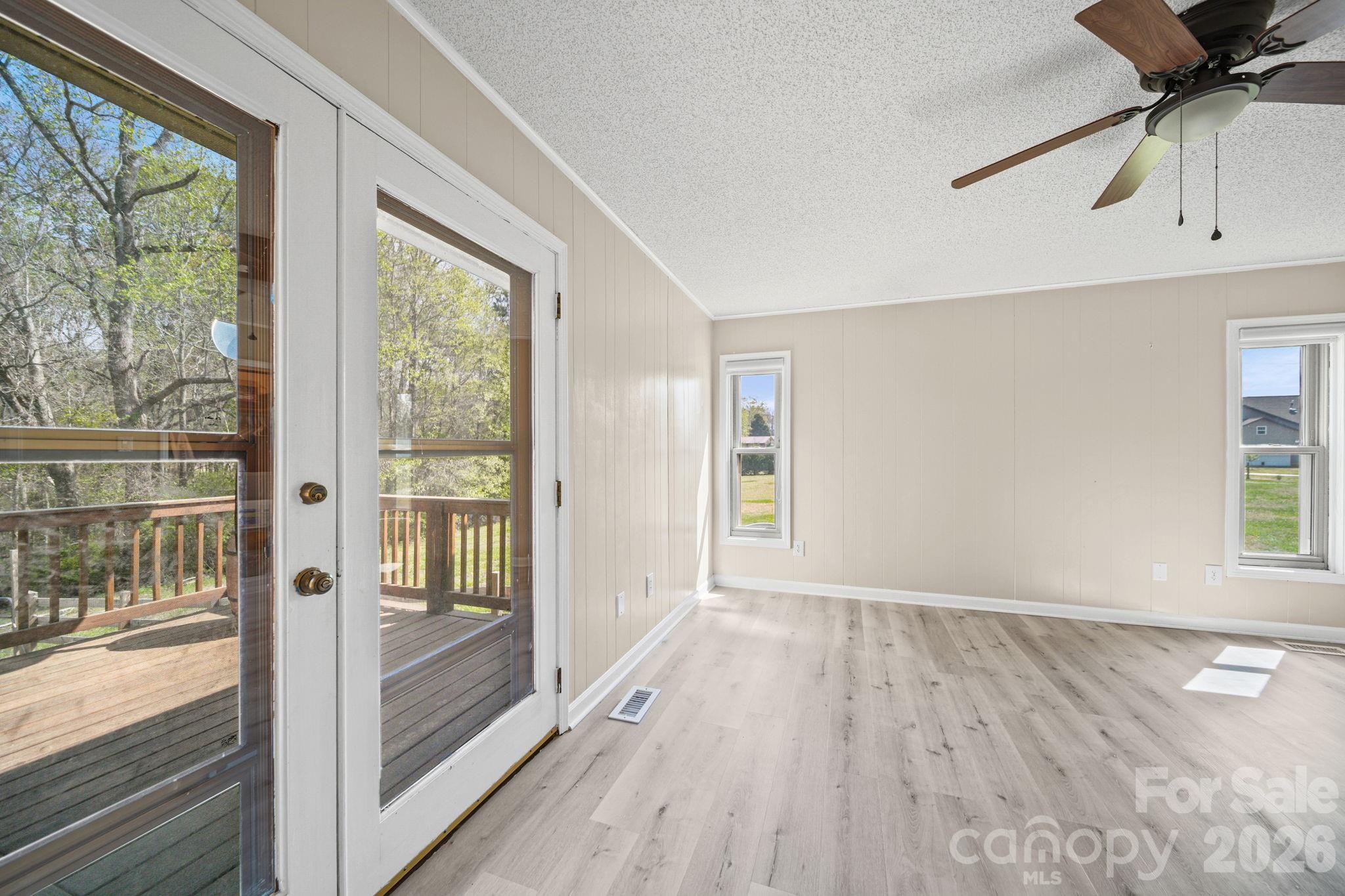 235 Spring Estates Circle Salisbury, NC 28146 - Photo 31 of 47 a view of an empty room with a window and wooden floor