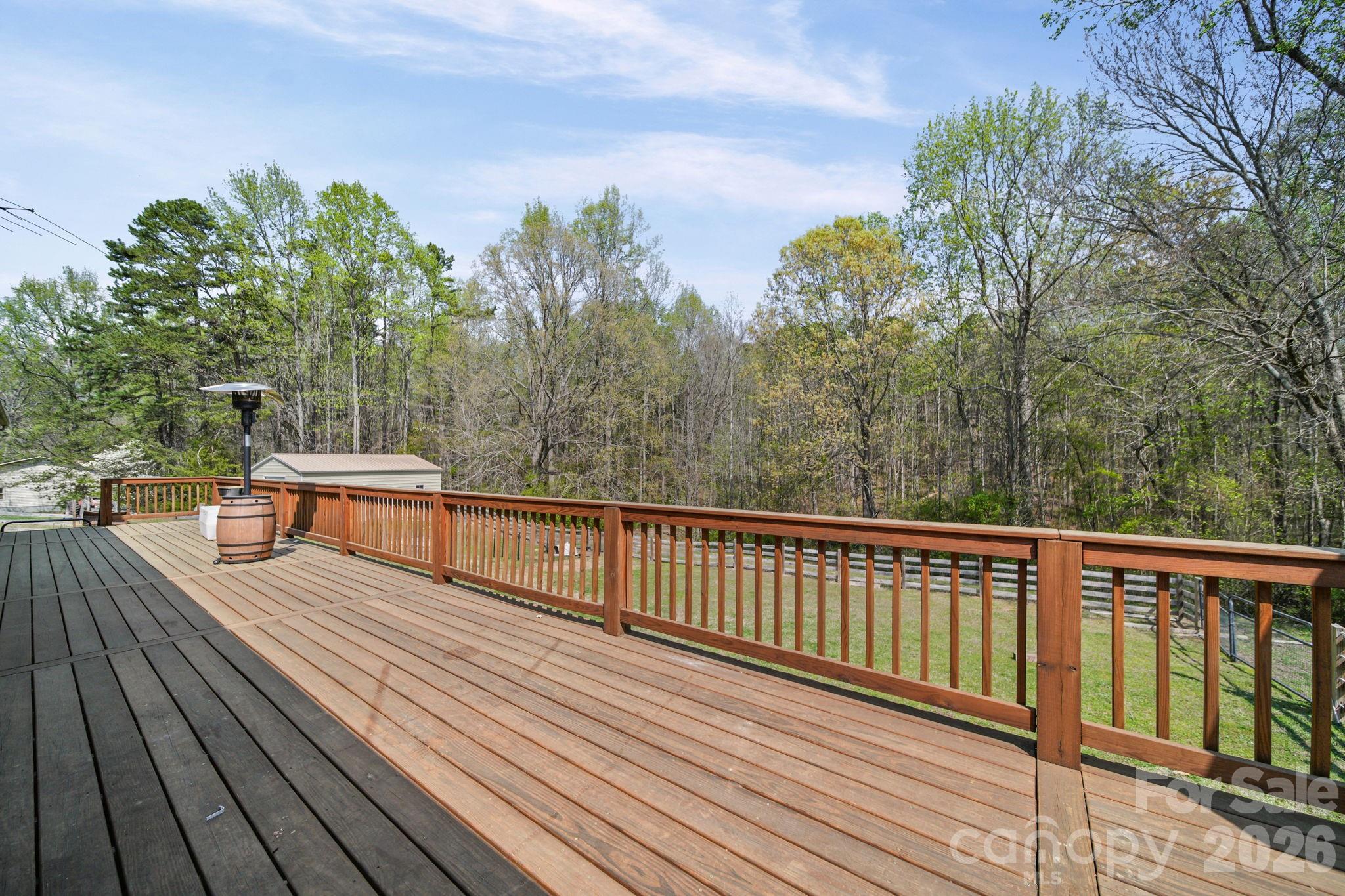 235 Spring Estates Circle Salisbury, NC 28146 - Photo 35 of 47 a balcony with wooden floor and bench