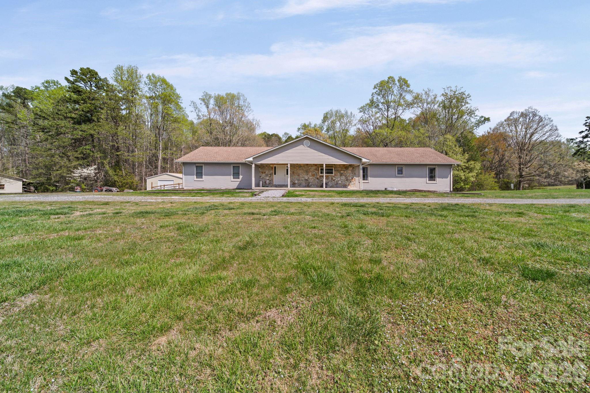 235 Spring Estates Circle Salisbury, NC 28146 - Photo 38 of 47 a front view of a house with a garden and plants