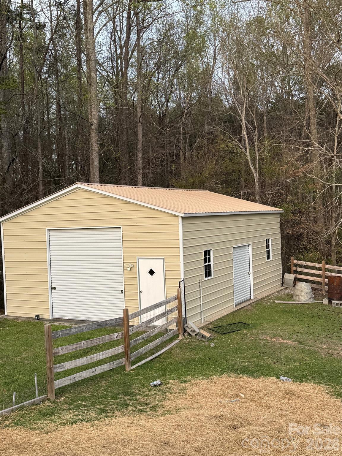 235 Spring Estates Circle Salisbury, NC 28146 - Photo 42 of 47 a view of a white house with a big yard and large trees