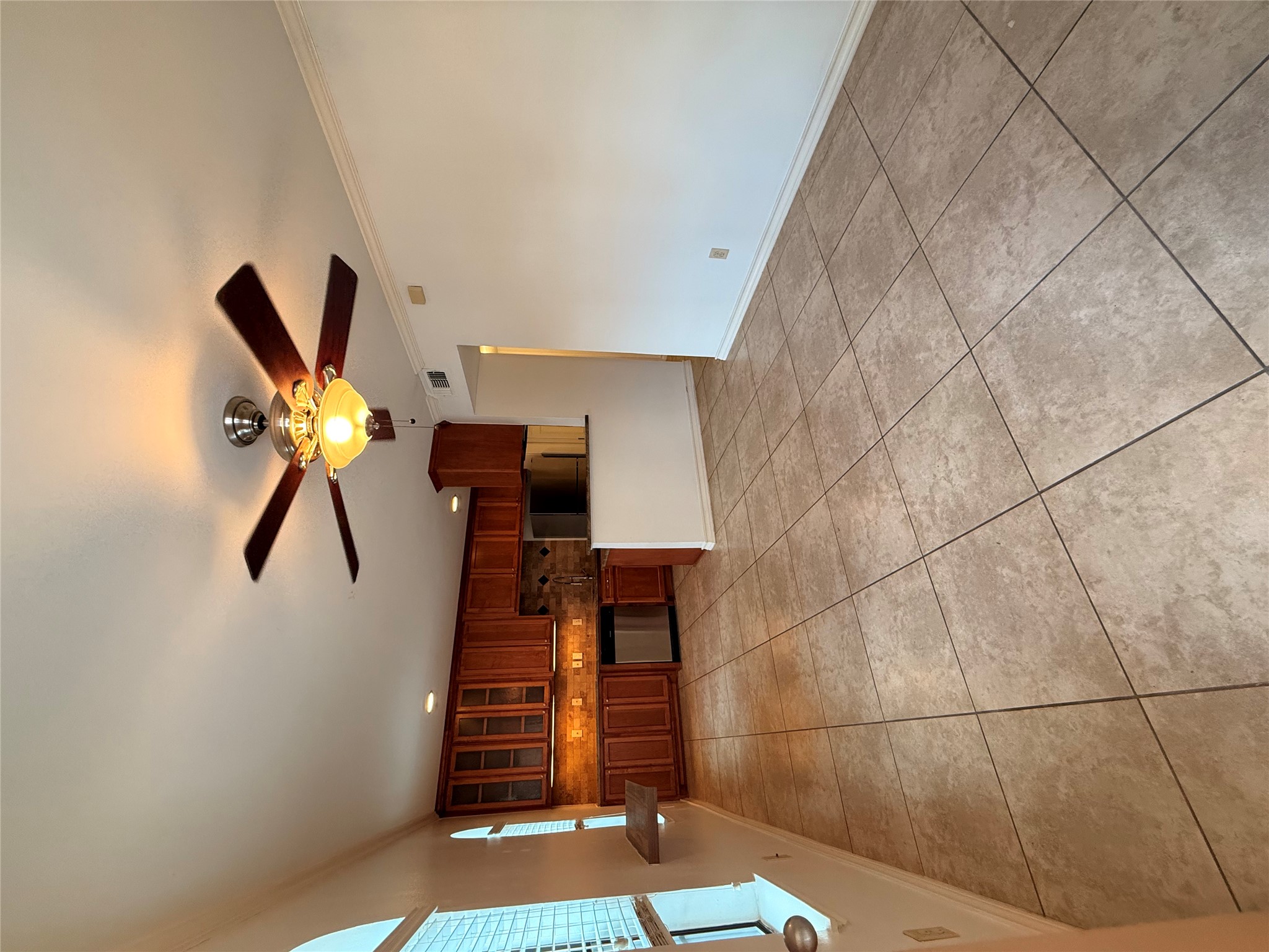 407 East 45th Street, Unit 104 Austin, TX 78751 - Photo 8 of 14 a living room with stainless steel appliances kitchen island granite countertop a rug and a large window