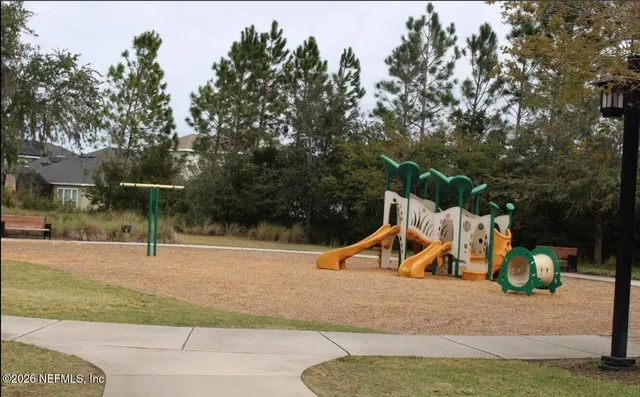 a view of a swimming pool with chairs