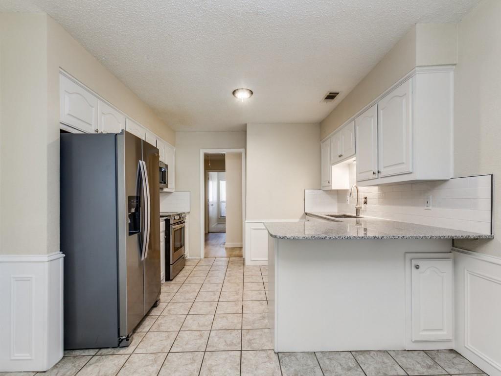516 Cedar Elm Lane Allen, TX 75002 - Photo 3 of 13 Back entrance into kitchen