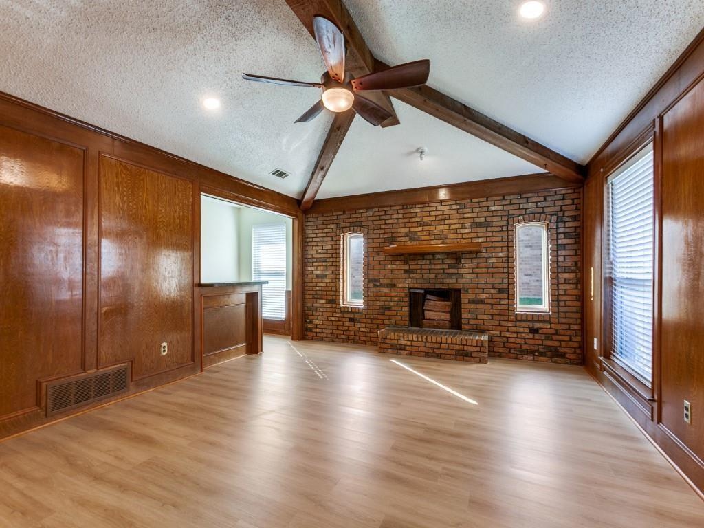 516 Cedar Elm Lane Allen, TX 75002 - Photo 5 of 13 with wood burning fire place and wet bar / office / craft space