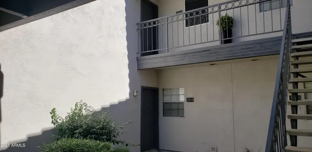 a view of balcony with furniture