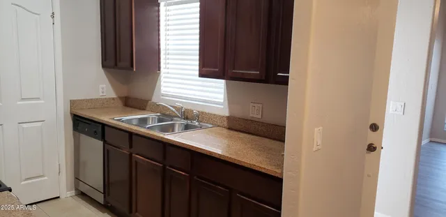 a kitchen with a sink and a window