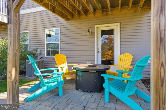a view of a two chairs in the balcony