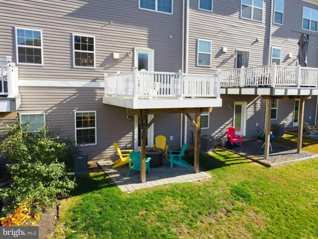 a view of an chairs and table in front of a house