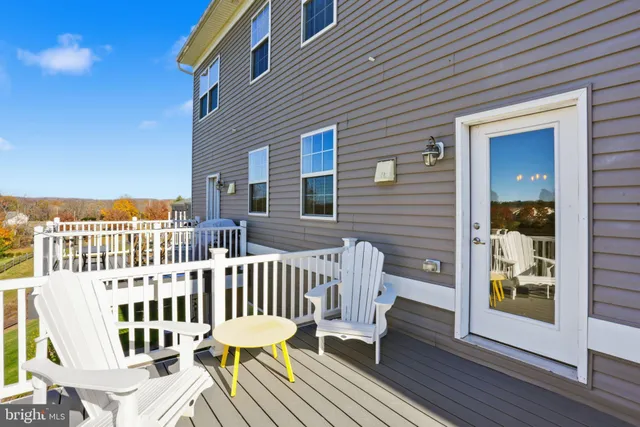 a view of a chair and table in the balcony