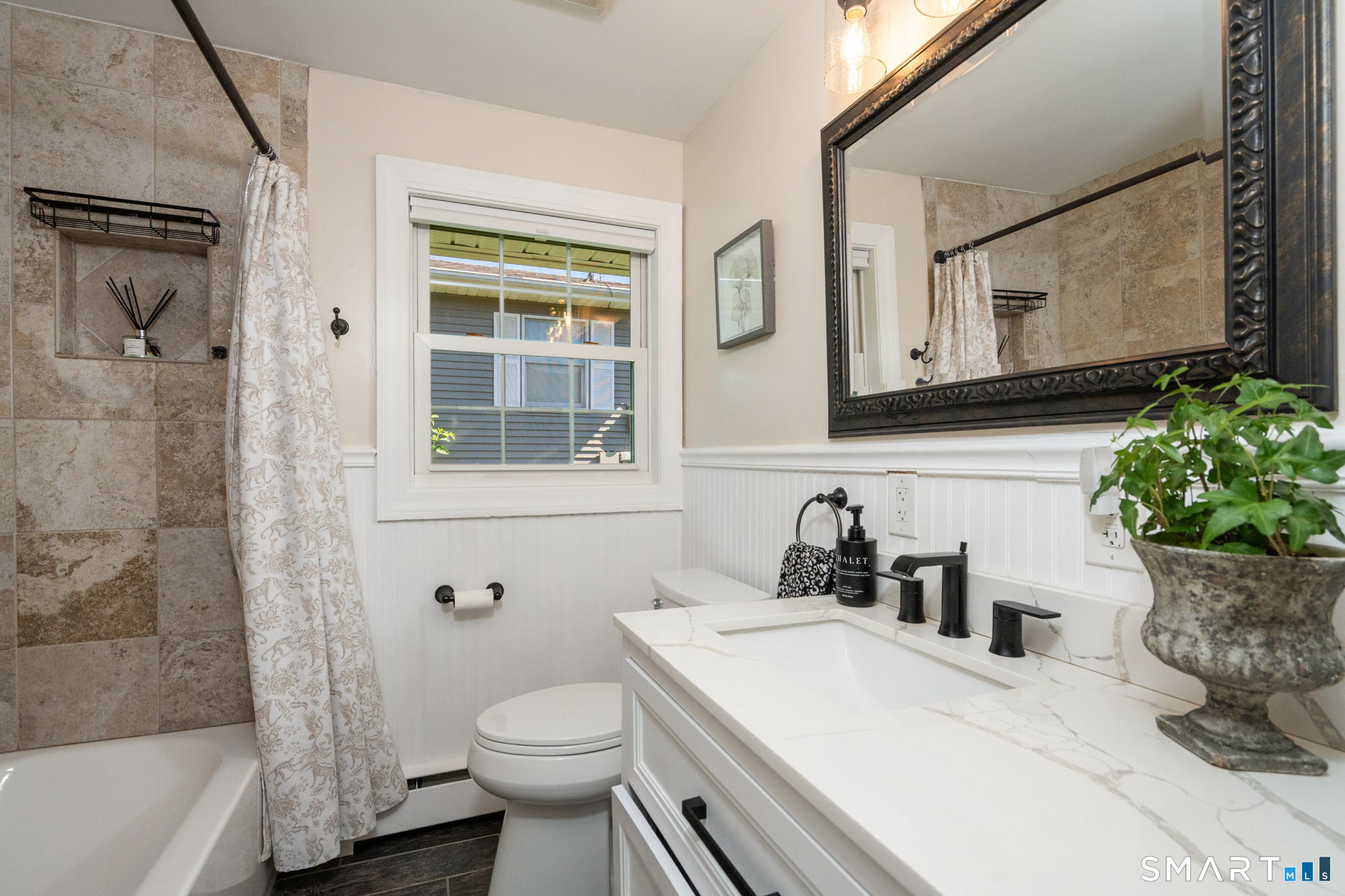 31 Cowan Street Suffield, CT 06078 - Photo 18 of 29 a bathroom with a sink a toilet and shower