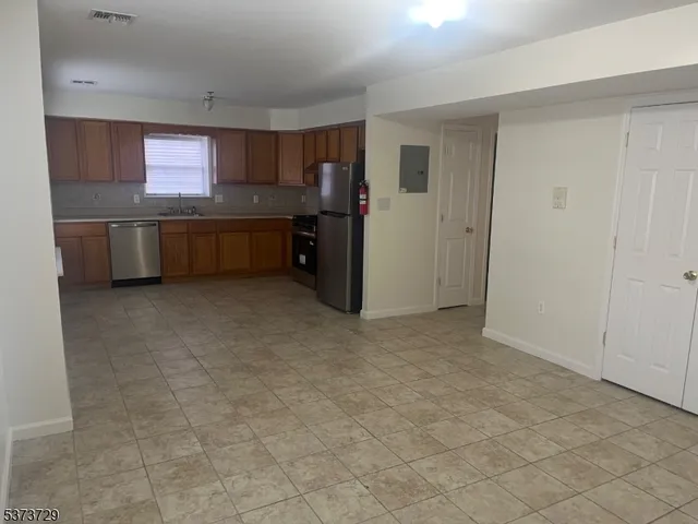 a view of a kitchen with a sink and dishwasher kitchen view