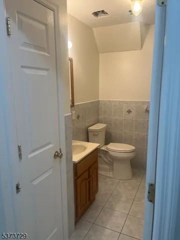a bathroom with a toilet sink and shower