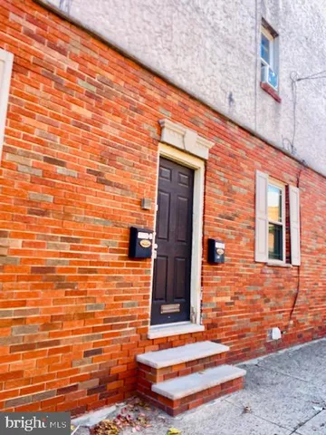 a brick building with a window