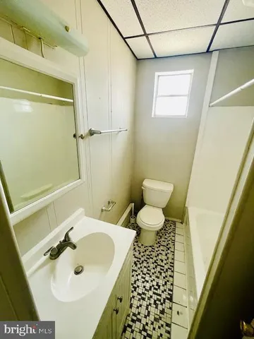a bathroom with a sink and a toilet