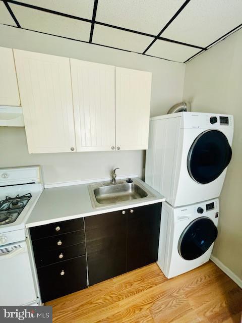 1117 McKean Street, Unit C Philadelphia, PA 19148 - Photo 6 of 12 a kitchen with a sink a stove and cabinets