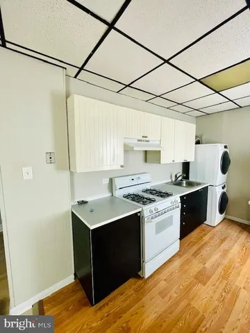 a kitchen with a stove and a sink