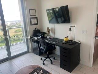 2000 Metropica Way, Unit 1902 Sunrise, FL 33323 - Photo 4 of 7 a view of a workspace with furniture and a window