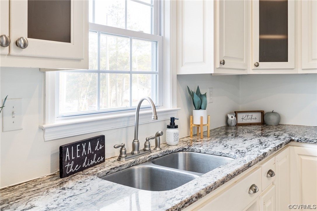 3612 Chesdin Boulevard Sutherland, VA 23885 - Photo 13 of 44 a kitchen with granite countertop a sink and a window