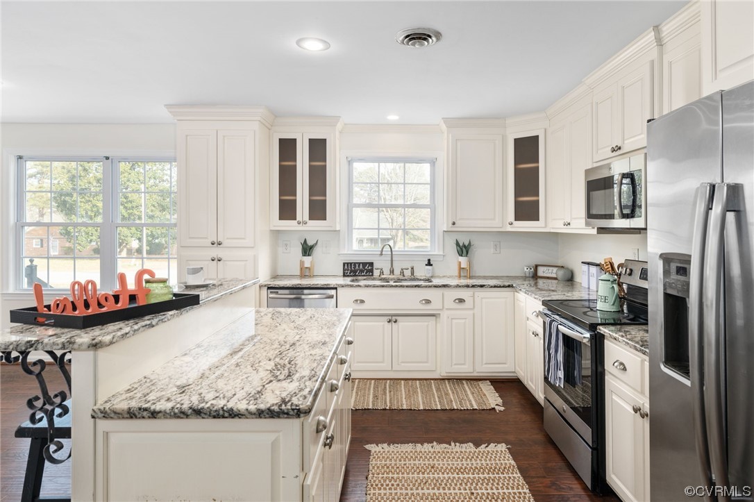 3612 Chesdin Boulevard Sutherland, VA 23885 - Photo 14 of 44 a kitchen with stainless steel appliances granite countertop a sink stove and refrigerator