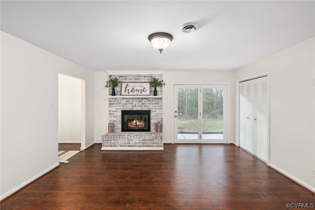 3612 Chesdin Boulevard Sutherland, VA 23885 - Photo 17 of 44 a view of a livingroom with a fireplace wooden floor and window