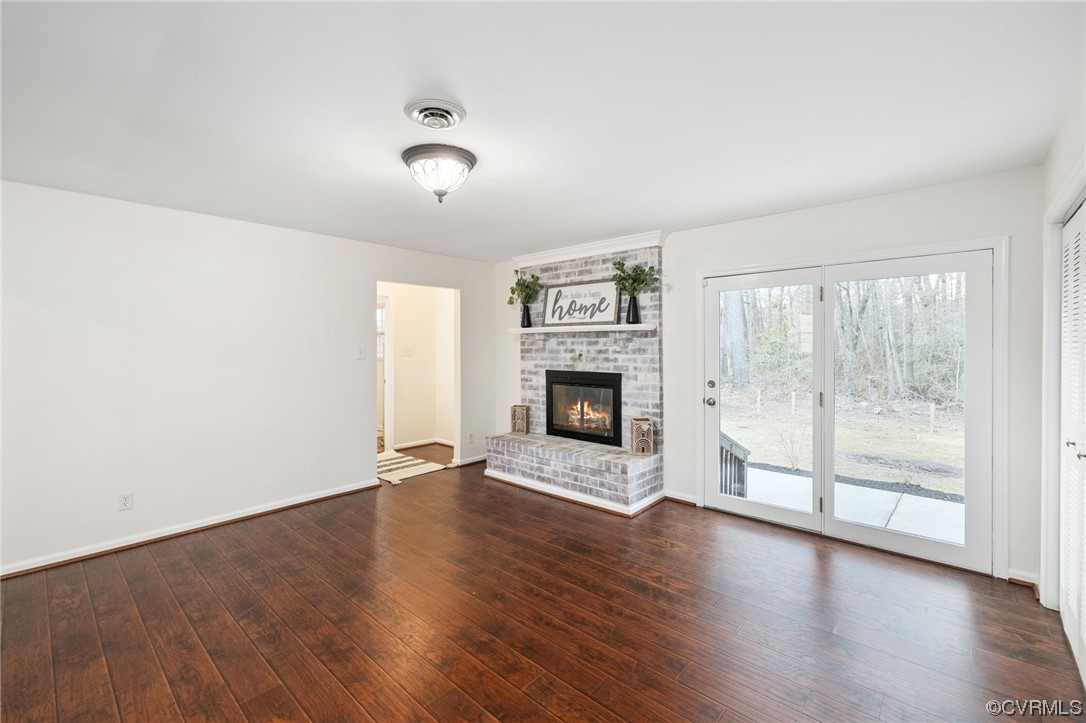 3612 Chesdin Boulevard Sutherland, VA 23885 - Photo 18 of 44 wooden floor fireplace and natural light in room
