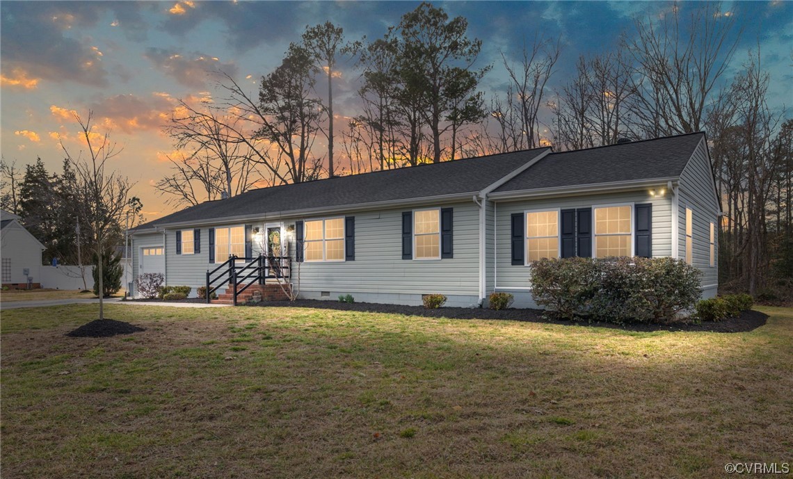 3612 Chesdin Boulevard Sutherland, VA 23885 - Photo 2 of 44 a front view of a house with a yard