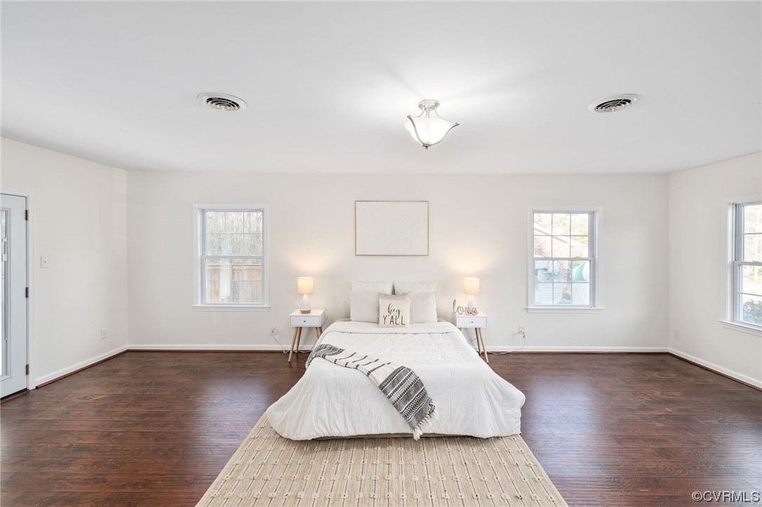 3612 Chesdin Boulevard Sutherland, VA 23885 - Photo 23 of 44 a bedroom with a bed and wooden floor