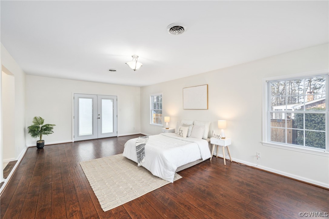 3612 Chesdin Boulevard Sutherland, VA 23885 - Photo 24 of 44 a bedroom with a bed and wooden floor