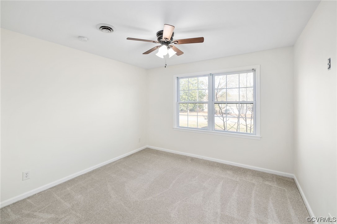 3612 Chesdin Boulevard Sutherland, VA 23885 - Photo 30 of 44 an empty room with a window and a fan