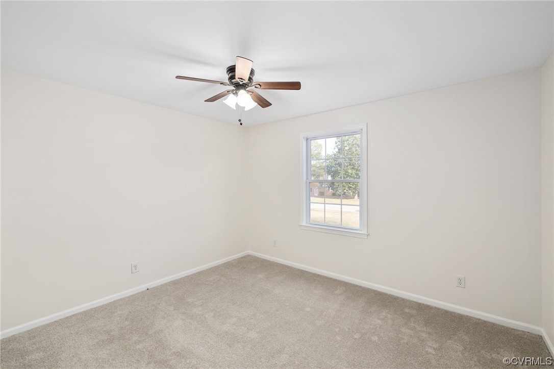 3612 Chesdin Boulevard Sutherland, VA 23885 - Photo 31 of 44 an empty room with windows and fan