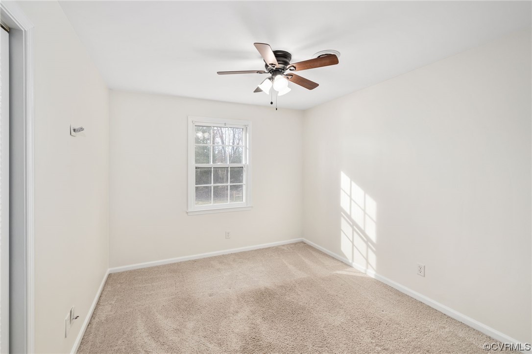 3612 Chesdin Boulevard Sutherland, VA 23885 - Photo 33 of 44 an empty room with windows and fan