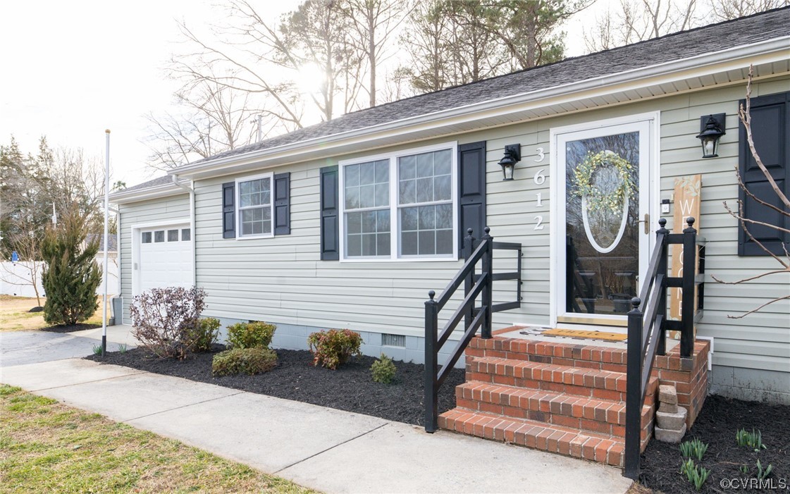 3612 Chesdin Boulevard Sutherland, VA 23885 - Photo 6 of 44 a front view of a house with garden