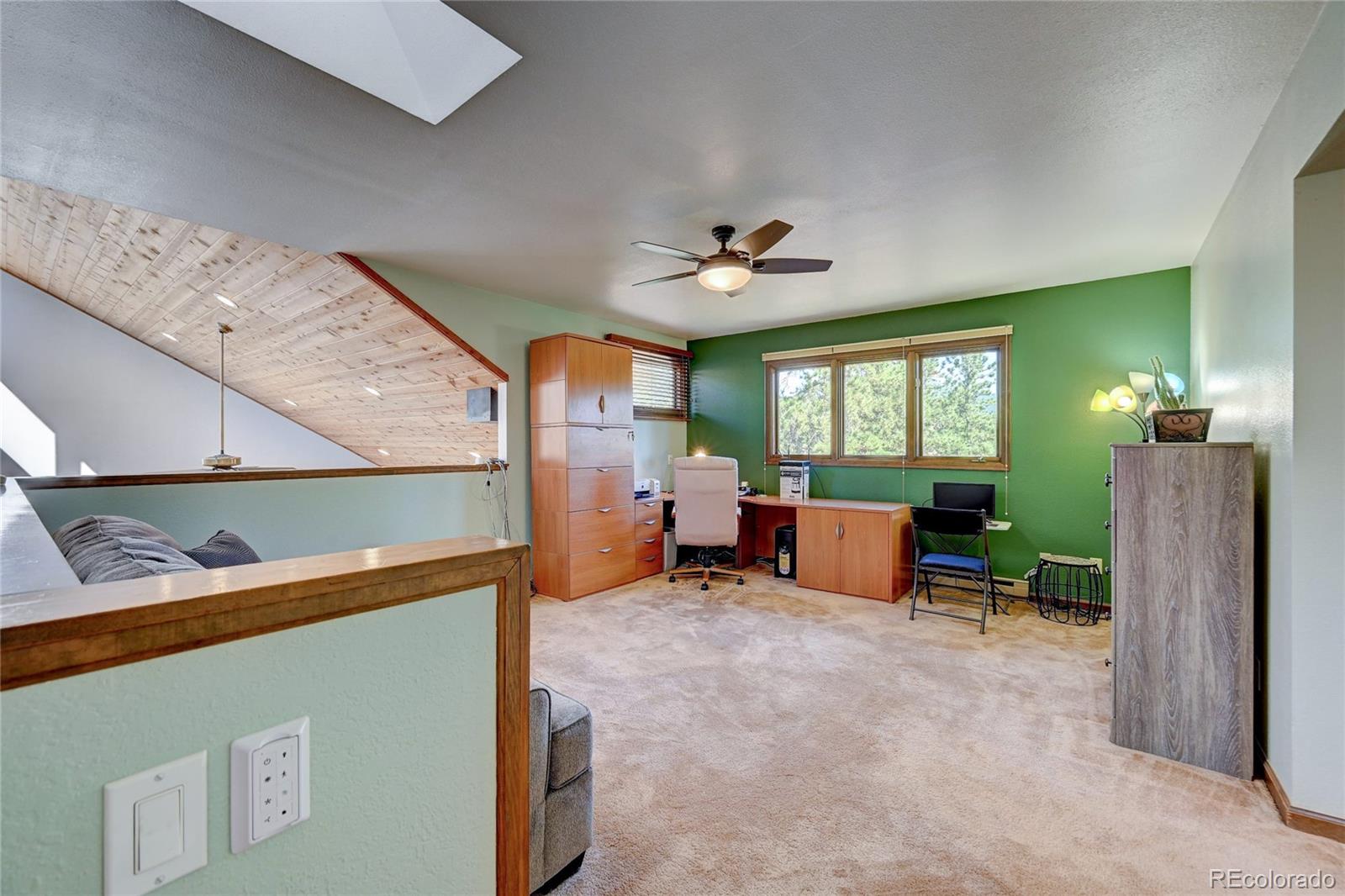 411 Spring Drive Pine, CO 80470 - Photo 20 of 40 a view of a livingroom with furniture and a window