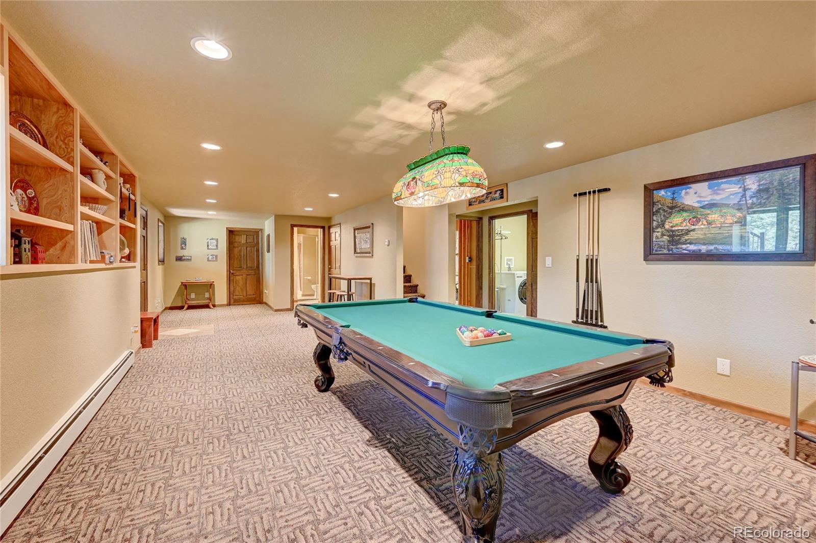 411 Spring Drive Pine, CO 80470 - Photo 25 of 40 a room with pool table and windows