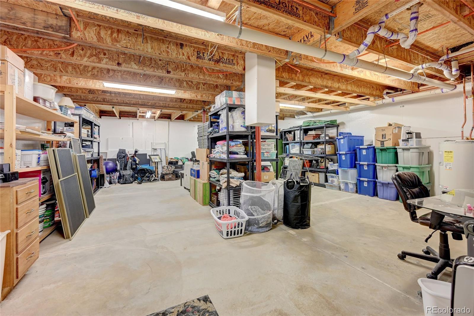 411 Spring Drive Pine, CO 80470 - Photo 30 of 40 a view of a storage room with air conditioner