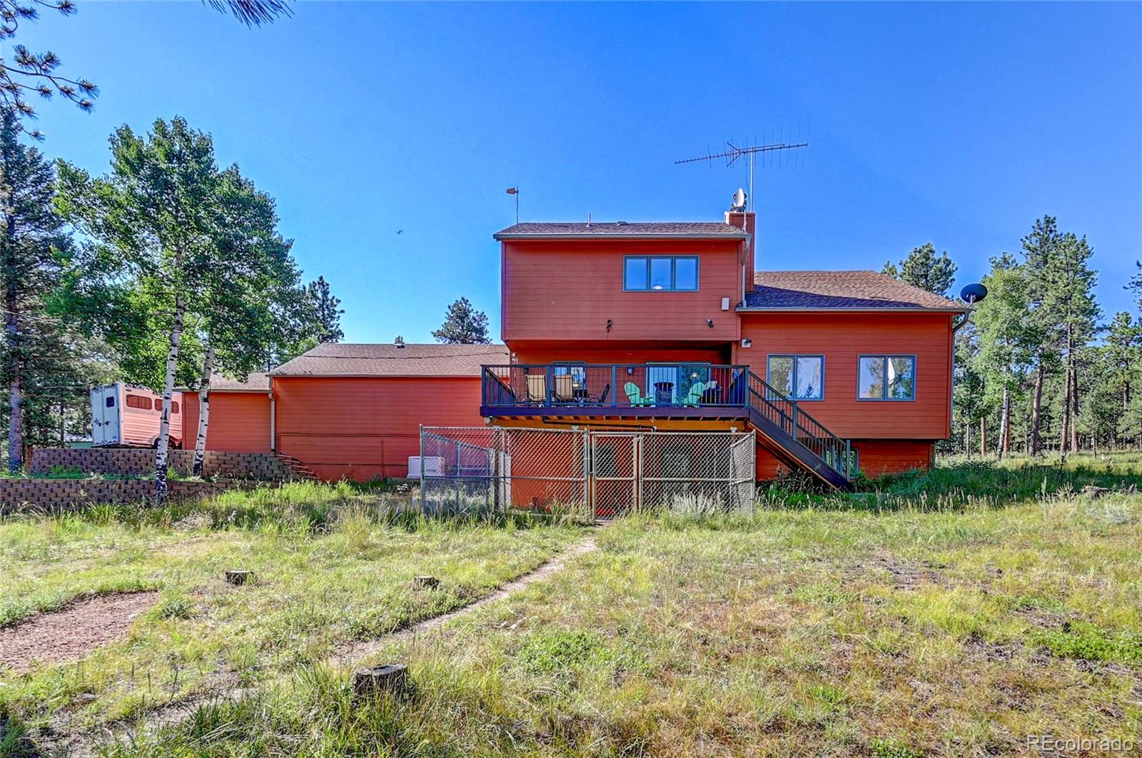 411 Spring Drive Pine, CO 80470 - Photo 39 of 40 a front view of a house with a yard
