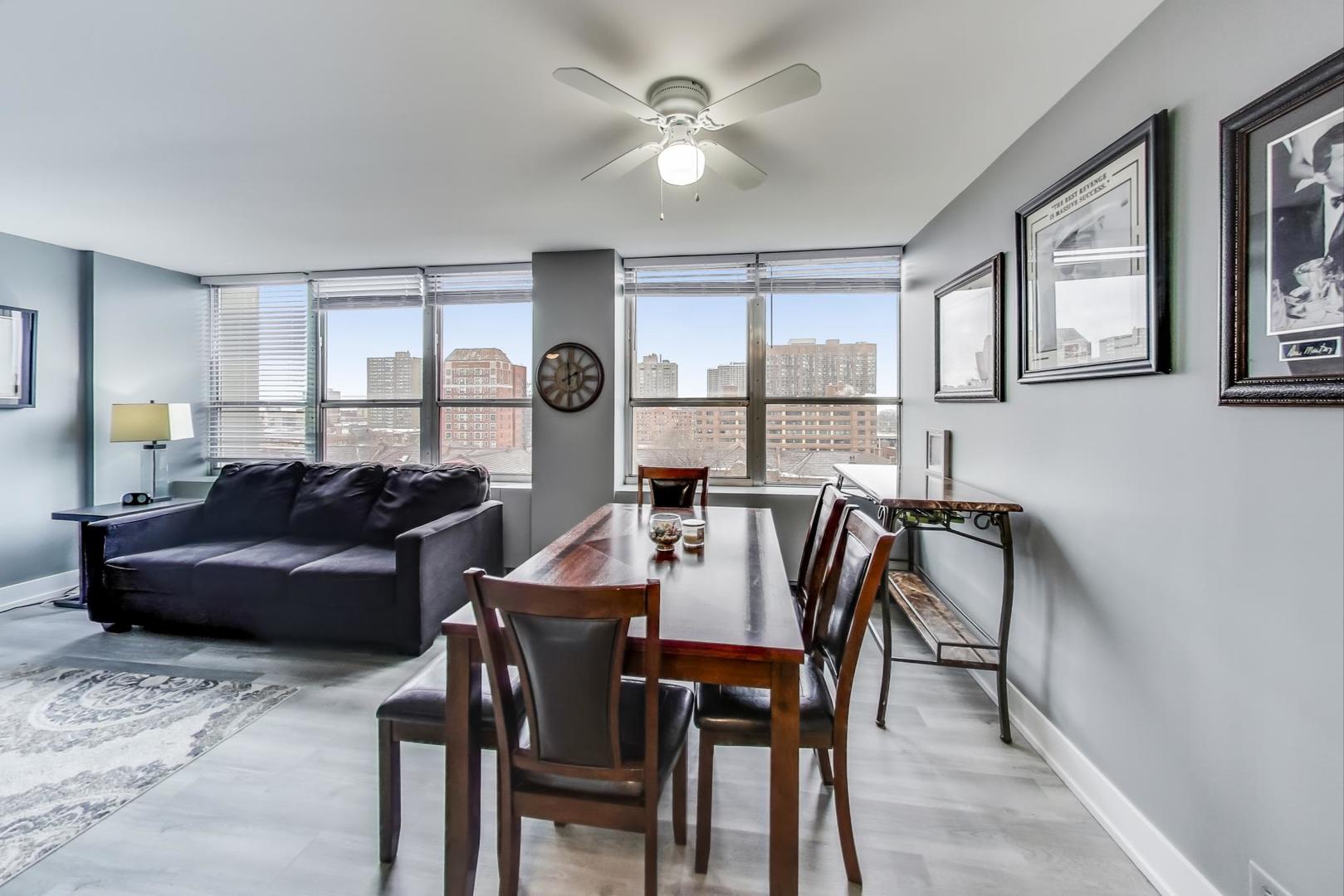 655 West Irving Park Road, Unit 814 Chicago, IL 60613 - Photo 8 of 34 a living room with furniture and a large window