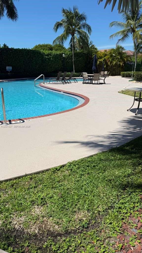 2120 Northeast 37th Road, Unit 1 Homestead, FL 33033 - Photo 6 of 30 a view of a swimming pool with a yard