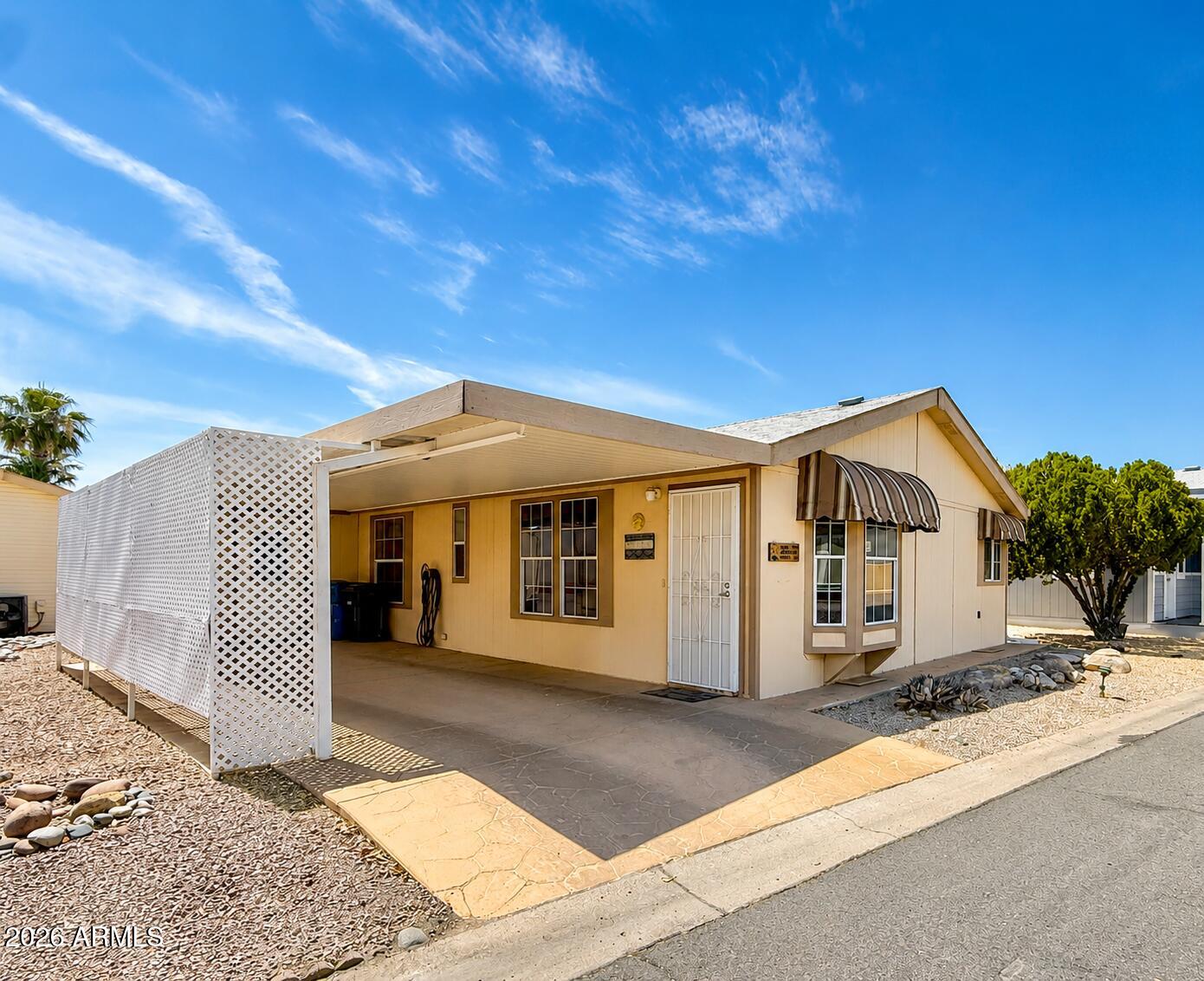 8865 East Baseline Road, Unit 103 Mesa, AZ 85209 - Photo 30 of 47 a front view of a house with a garage