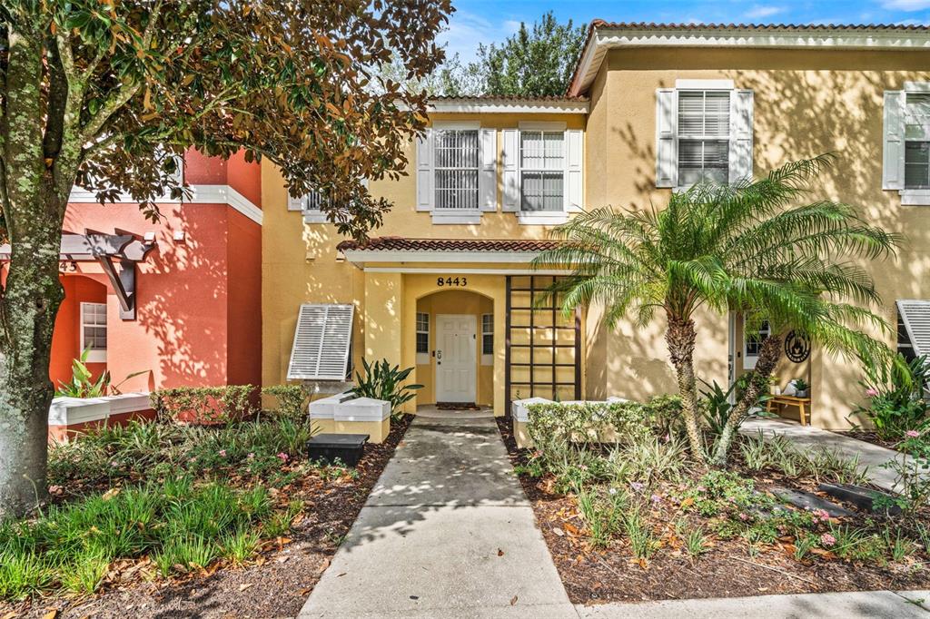 8443 Crystal Cove Loop Kissimmee, FL 34747 - Photo 1 of 1 a front view of a house with garden