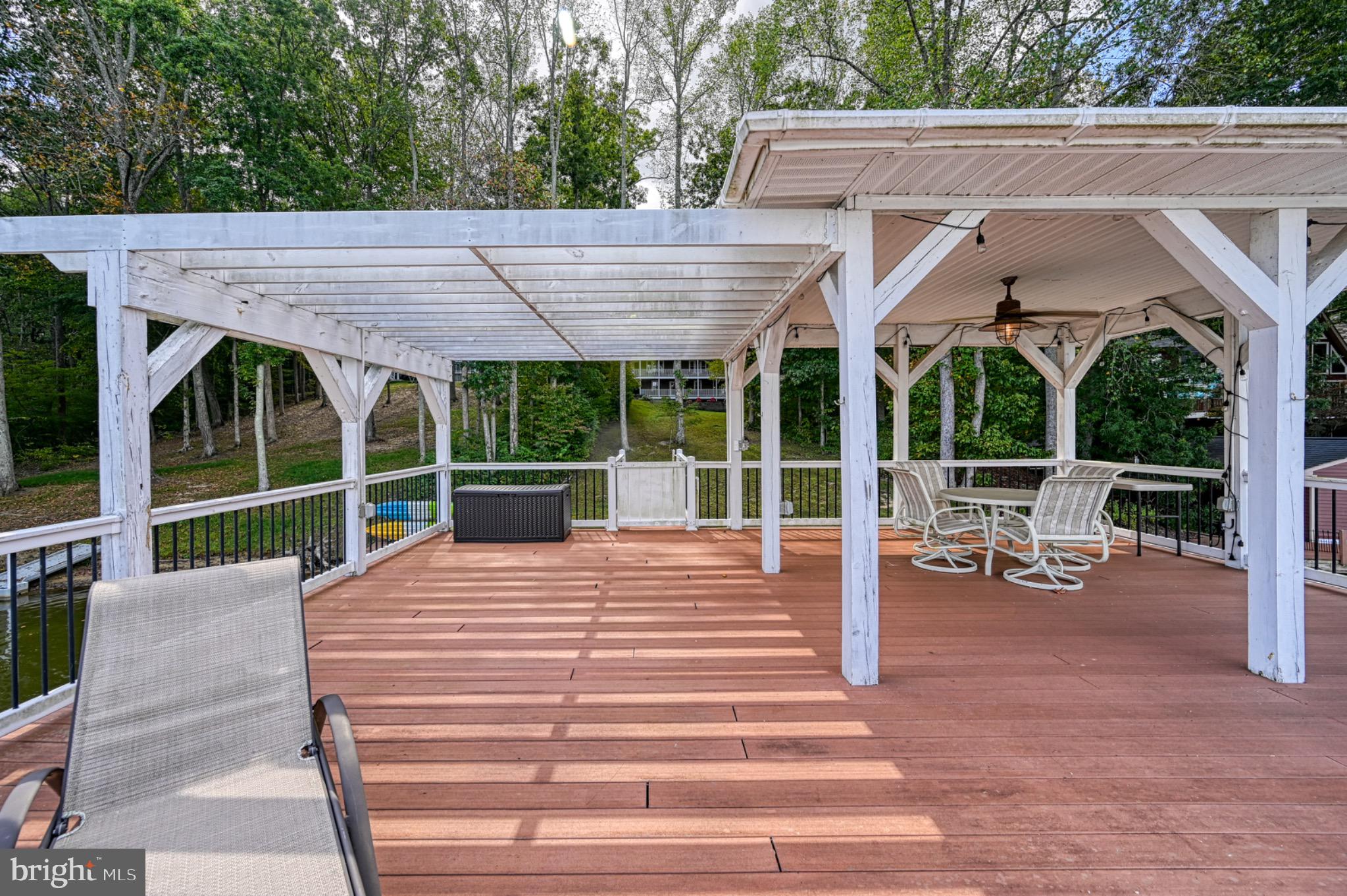 7320 Old Dickersons Road Orange, VA 22960 - Photo 104 of 119 a view of a patio with table and chairs potted plants and a large tree
