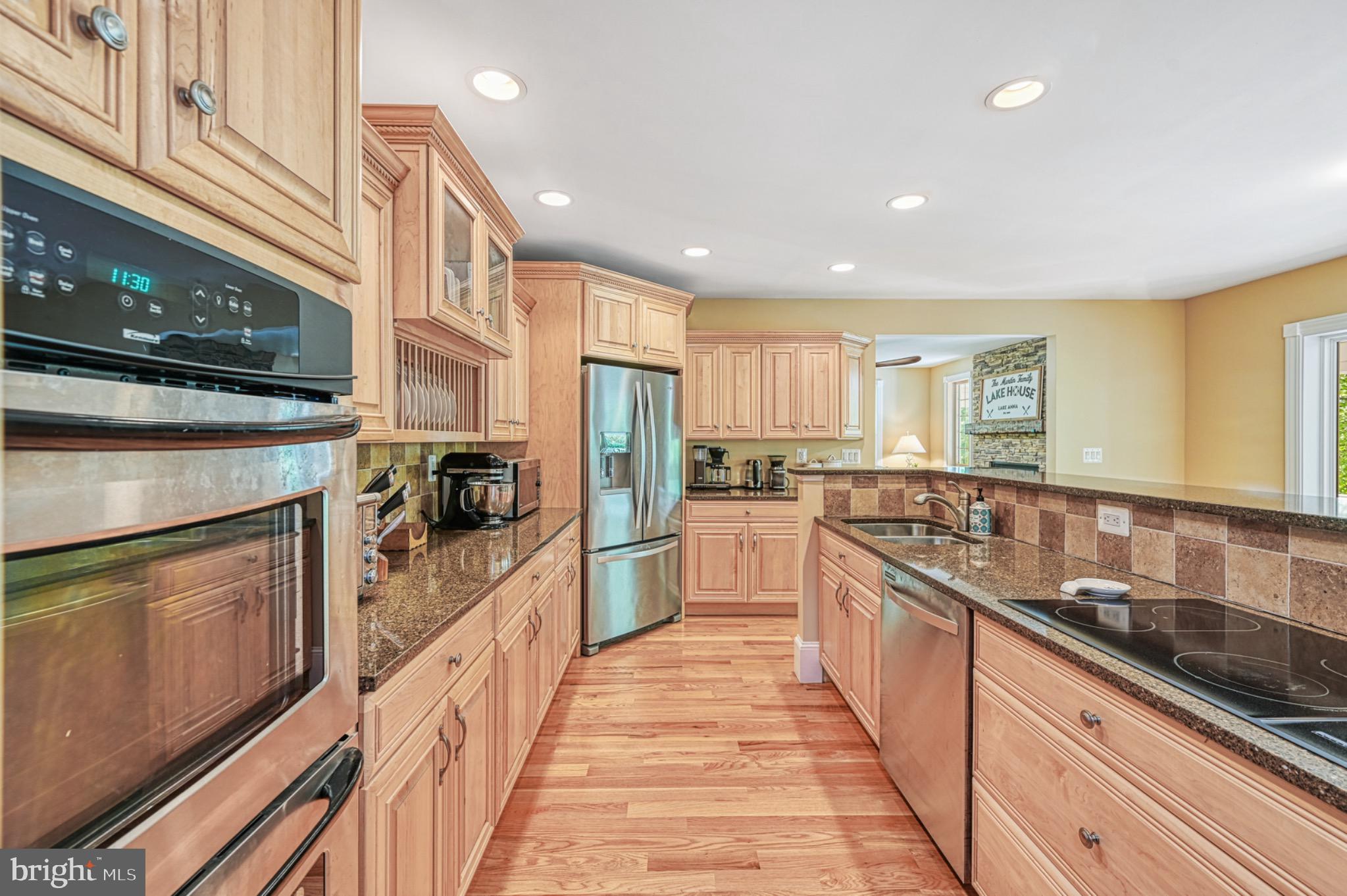 7320 Old Dickersons Road Orange, VA 22960 - Photo 17 of 119 a large kitchen with stainless steel appliances granite countertop a lot of counter space and a sink