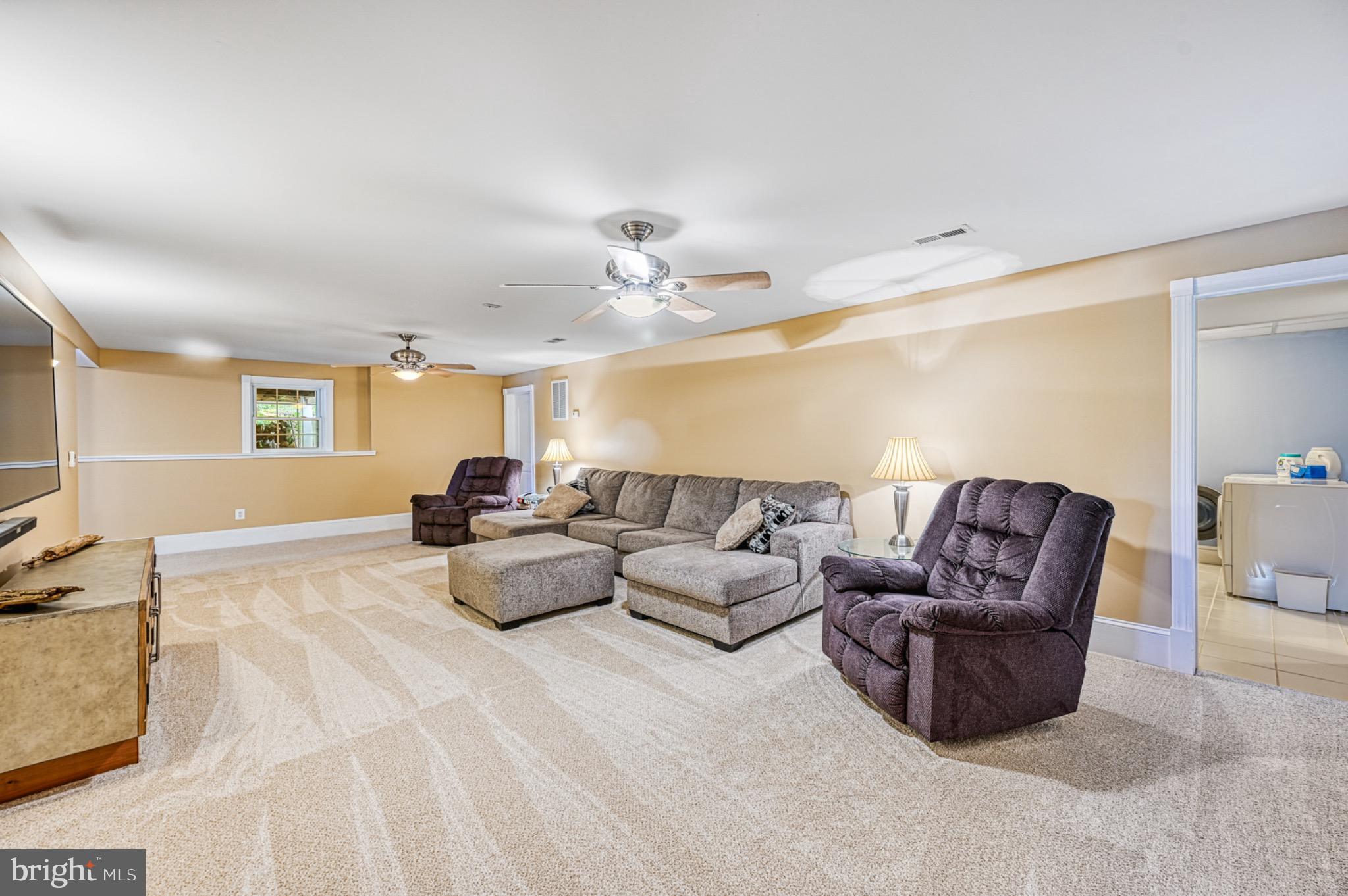 7320 Old Dickersons Road Orange, VA 22960 - Photo 72 of 119 a living room with furniture and a chandelier
