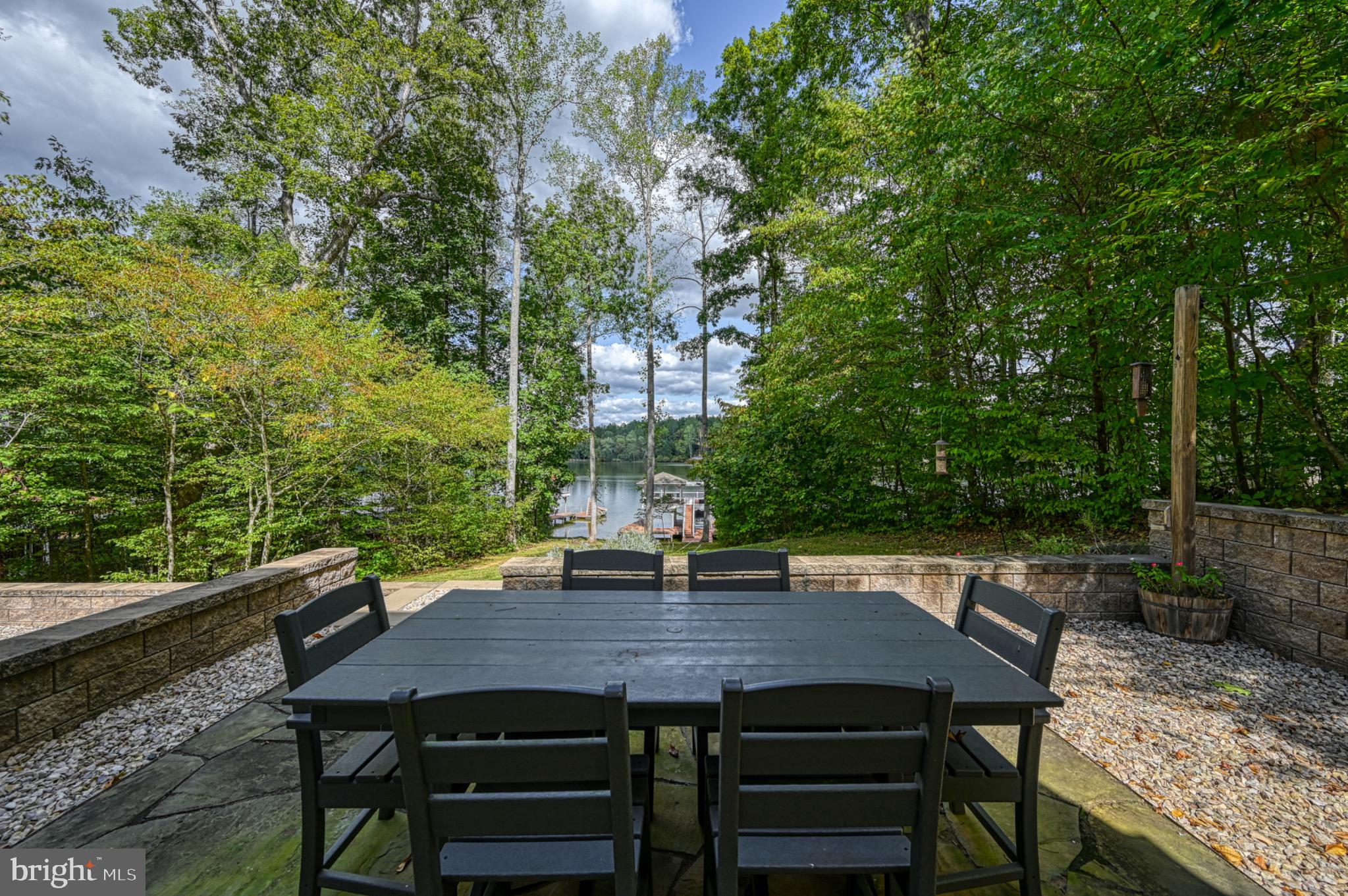 7320 Old Dickersons Road Orange, VA 22960 - Photo 93 of 119 Serene lakeside dining amidst lush greenery.